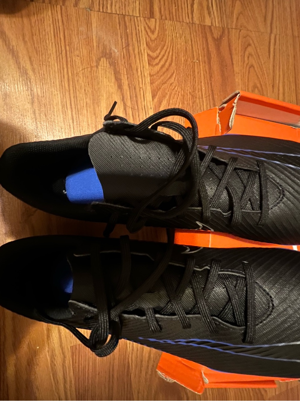 Nike Men's Black Soccer Cleats with Blue Sole Accents